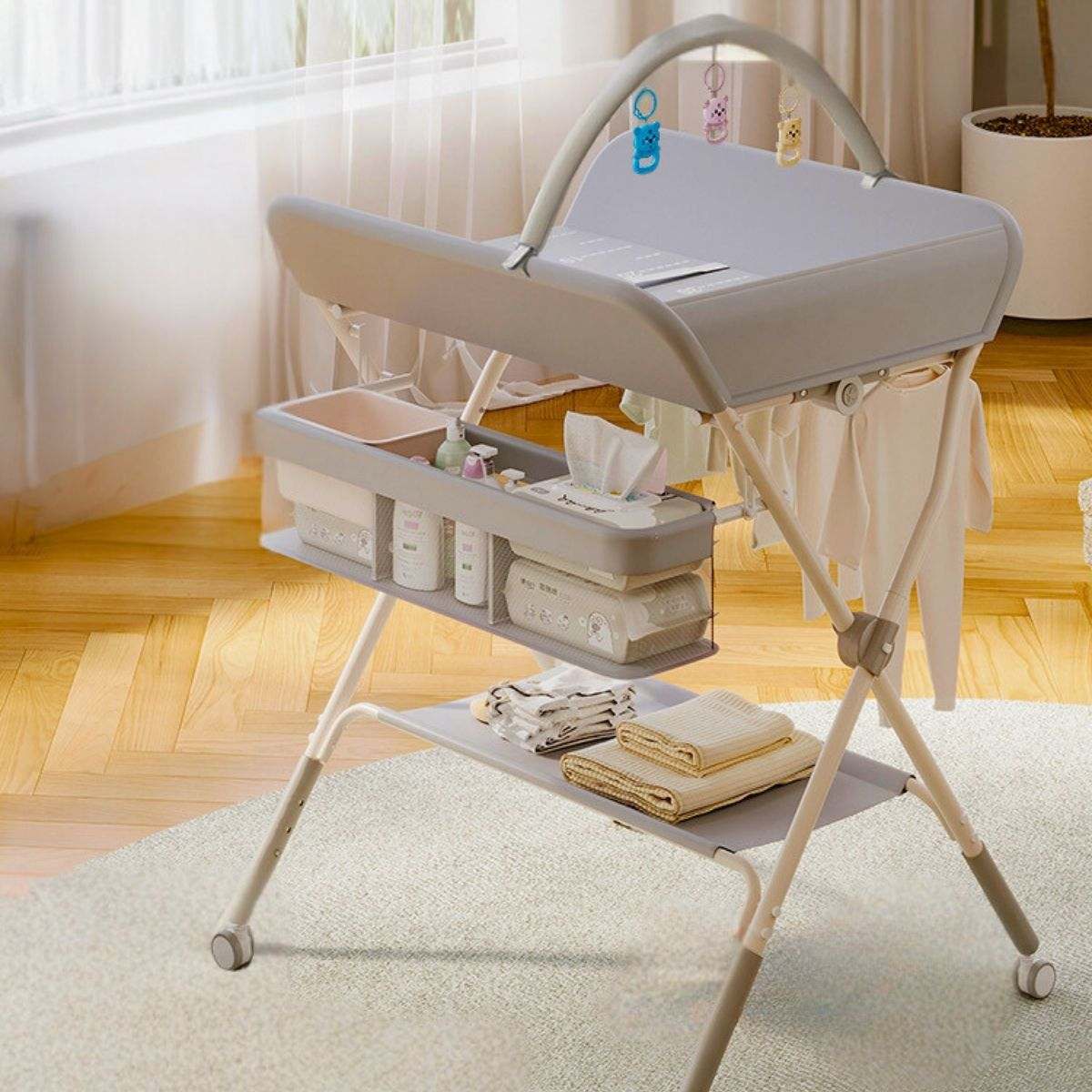Toddly FlexiStation Adjustable Changing Table with Hanging Toys - Grey